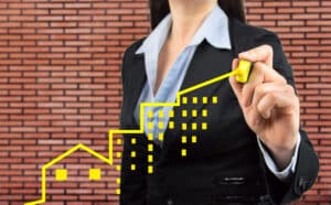 businesswoman is making a positive trend in investment real estate concept with black background. All screen content is designed by me and not copyrighted by others and created with pen tablet and ps